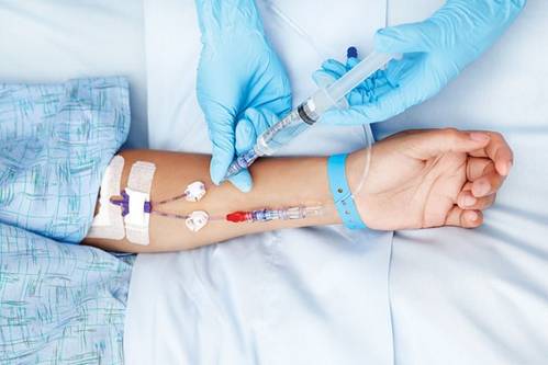 A person getting a blood sample

Description automatically generated